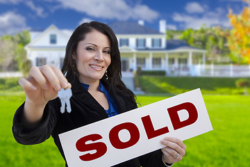 Image showing Woman Holding Sold Sign and Keys In Front of House