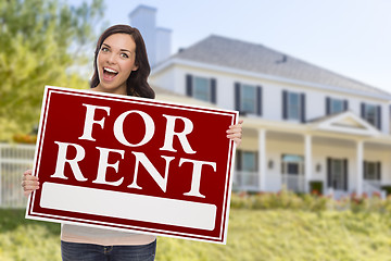 Image showing Ethnic Female Holding For Rent Sign In Front of House