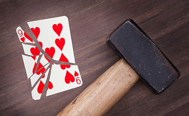 Image showing Hammer with a broken card, nine of hearts