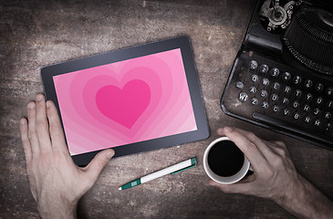 Image showing Heart shape backgound on tablet