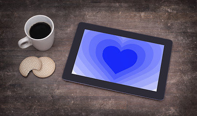 Image showing Heart shape backgound on tablet