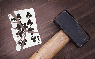 Image showing Hammer with a broken card, nine of clubs