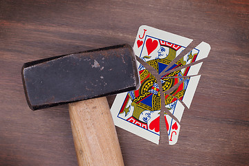 Image showing Hammer with a broken card, jack of hearts