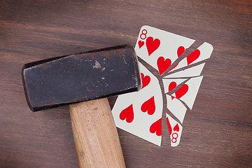 Image showing Hammer with a broken card, eight of hearts