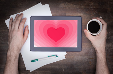 Image showing Heart shape backgound on tablet