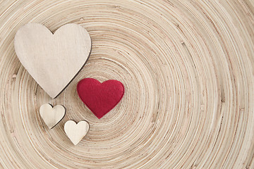 Image showing valentine's wooden hearts on a wooden background