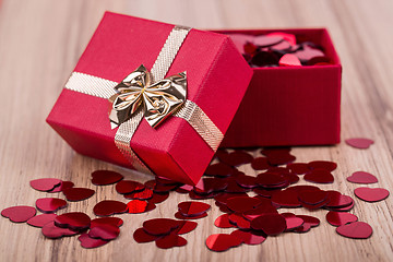Image showing Red hearts confetti in box valentine love concept