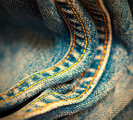 Image showing old Jeans with yellow stitching thread