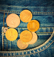 Image showing Coins and pocket jeans