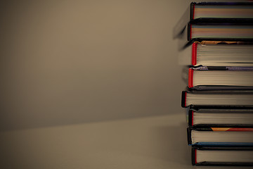 Image showing stack of books on the table