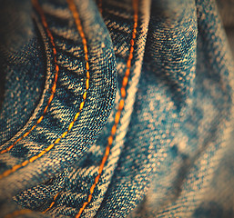 Image showing blue Jeans with yellow stitching thread