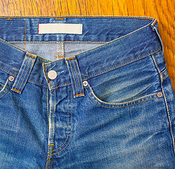 Image showing indigo jeans with a button