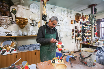 Image showing Man making carnival mask