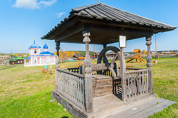 Image showing Old wooden water well in village