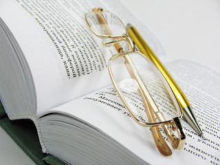 Image showing glasses & pen on book 1