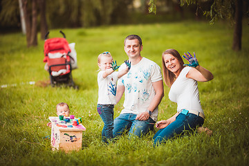 Image showing Happy family with nesting box and paints