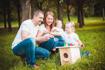 Image showing Happy family with nesting box and paints