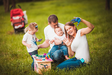 Image showing Happy family with nesting box and paints