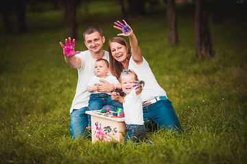 Image showing Happy family with nesting box and paints