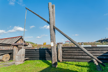 Image showing Old wooden water crane well in village