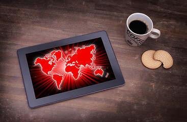 Image showing World map on a tablet
