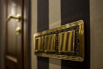 Image showing golden button Light Switch