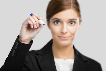 Image showing Businesswoman drawing on a glass board