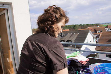 Image showing woman hanging laundry