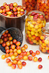 Image showing Preserving Mirabelle plums - jars of homemade fruit preserves - Mirabelle prune