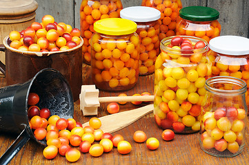 Image showing Preserving Mirabelle plums - jars of homemade fruit preserves - Mirabelle prune