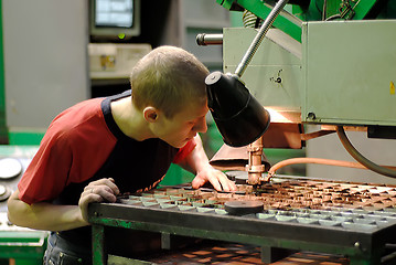 Image showing Milling-machine operator works at machine