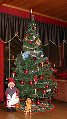Image showing Christmas tree with Mother Christmas and  Christmas goat.