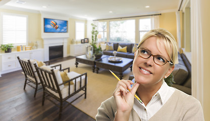 Image showing Daydreaming Woman with Pencil Inside Beautiful Living Room