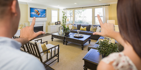 Image showing Young Couple Framing Hands of Home Interior