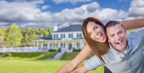 Image showing Playful Young Military Couple Outside Beautiful Home