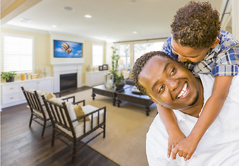 Image showing Afrian American Father and Mixed Race Son in Living Room