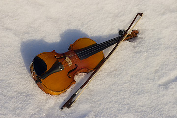 Image showing A violin in snow.