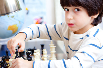 Image showing boy playing a game of chess