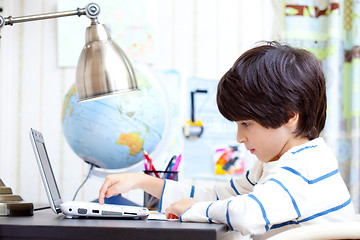 Image showing young student working on a computer