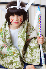 Image showing boy playing with a indian spear