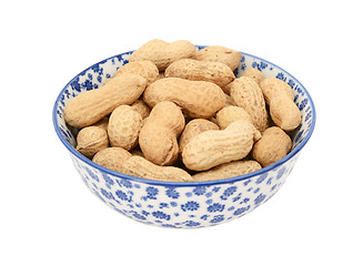 Image showing Monkey nuts in a blue and white china bowl