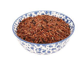 Image showing Camargue red rice in a blue and white china bowl
