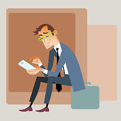 Image showing Businessman traveler sits on the bag and reads smartphone