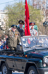 Image showing Veterans of World War 2 salute from SUV on parade