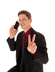 Image showing Man holding cell phone.