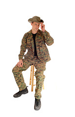 Image showing Sitting soldier relaxed.