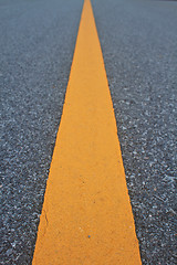 Image showing asphalt road with marking lines and tire tracks