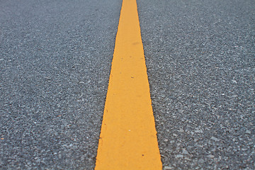 Image showing asphalt road with marking lines and tire tracks