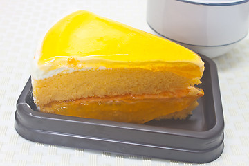 Image showing Orange Cheesecake in plate on background