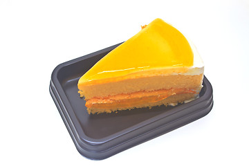 Image showing  Orange Cheesecake in plate on background